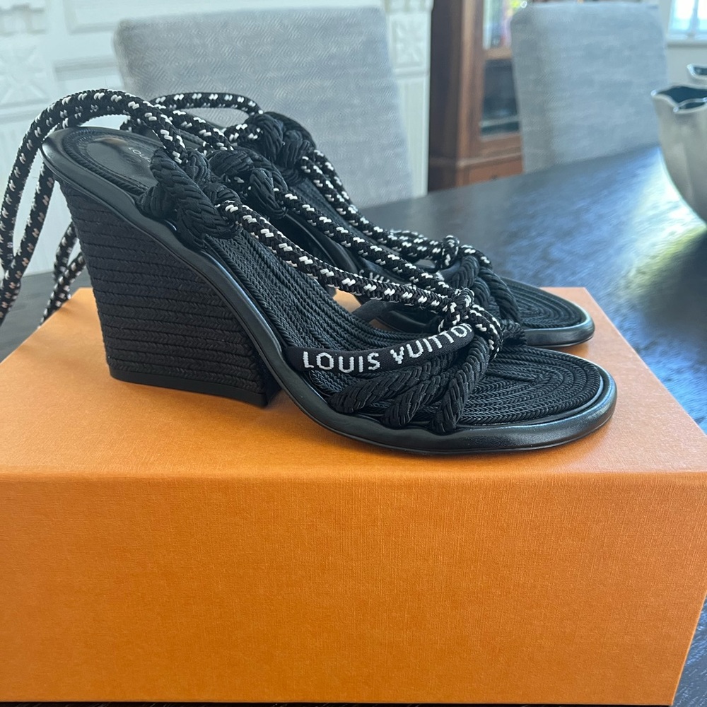 Louis Vuitton sandals.